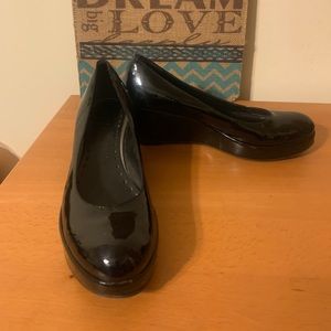 Black patent leather wedge shoes